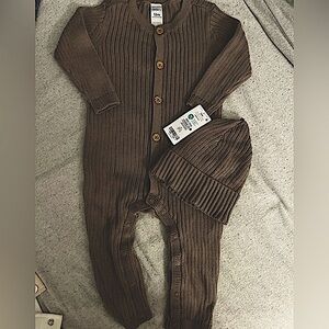 A CARTER’S one piece with matching beanie